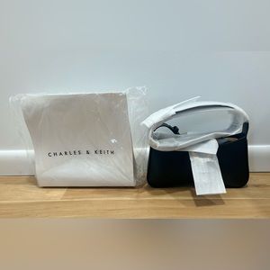 Charles & Keith Gabine Curved Shoulder Bag. New original packaging. Black.